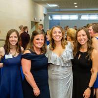 Group of girls posing in the Laker Lounge.